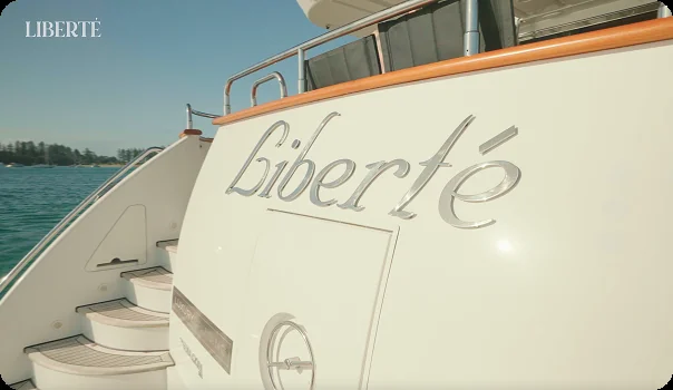 Liberté name on the yacht stern, on a private yacht charter from Auckland