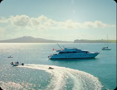 Luxury yacht anchored in a New Zealand bay for a corporate charter from Auckland