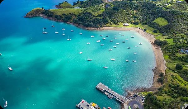 Sheltered Waiheke Island bay visited on a private yacht holiday, for luxury yacht holidays from Auckland
