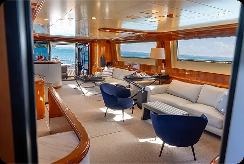 The spacious saloon aboard Liberté, on a private yacht charter from Auckland