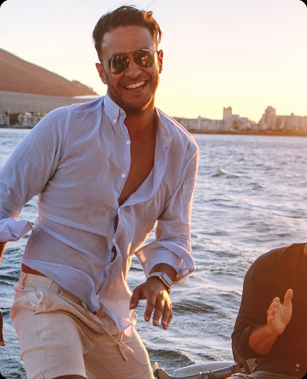 Friends celebrating a stag do aboard a yacht, on a private yacht charter from Auckland