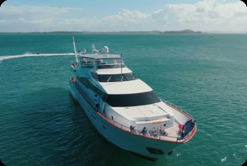Liberté cruising through the Hauraki Gulf, on a private yacht charter from Auckland